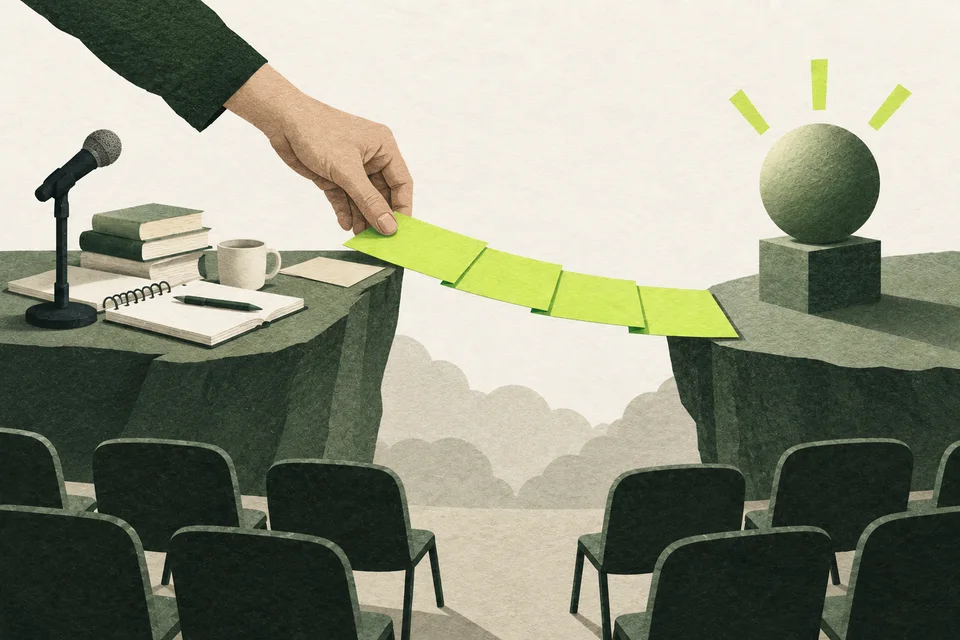 A hand builds a bridge of cards between books, a notebook and a microphone on one side and a highlighted sphere on the other.