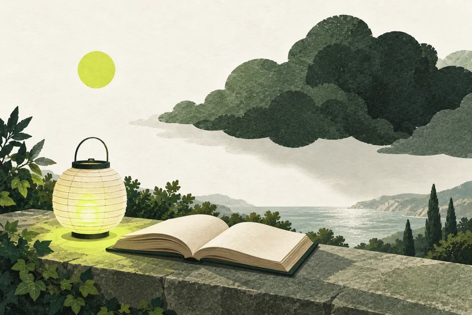 A paper lantern beside an open book lights a small space beneath a large green cloud.